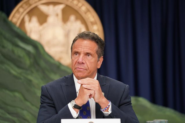 Governor Cuomo at a Manhattan press conference on July 6, 2020; he is sitting before his styrofoam mountain representing the number of Covid casses